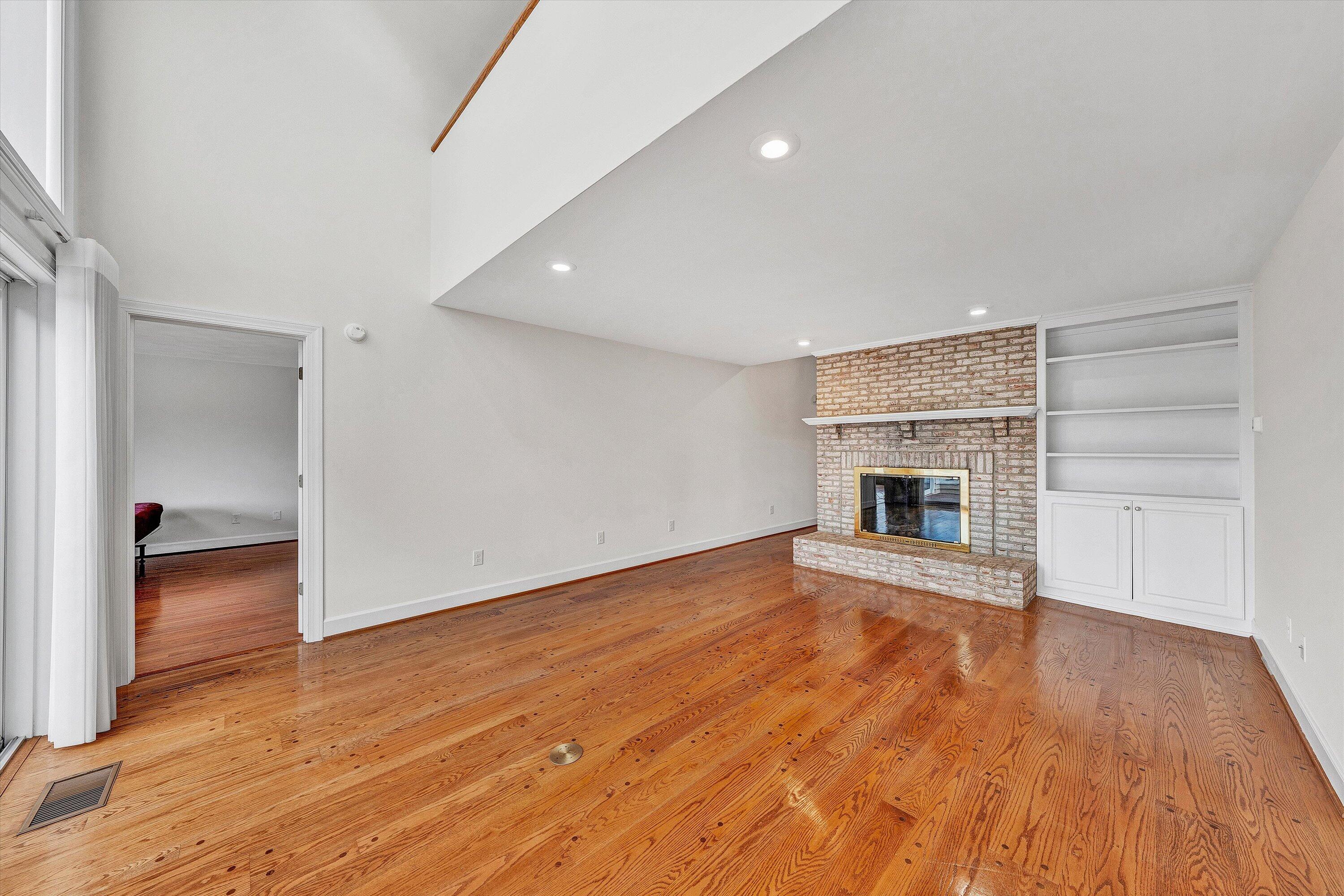 30 Island Green Circle, Unit 22 Penhook, VA 24137 - Photo 11 of 53 a view of empty room with wooden floor and fireplace
