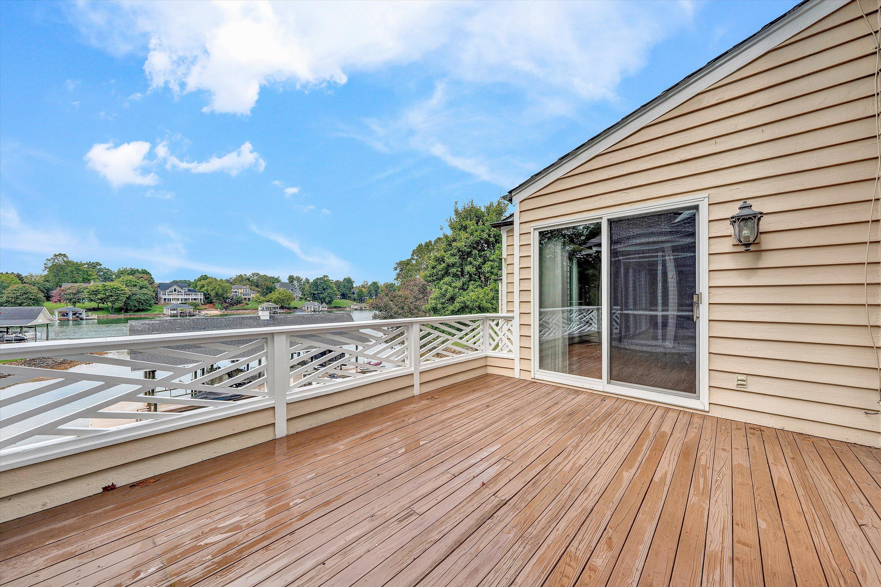 30 Island Green Circle, Unit 22 Penhook, VA 24137 - Photo 13 of 53 a view of balcony with wooden floor and fence