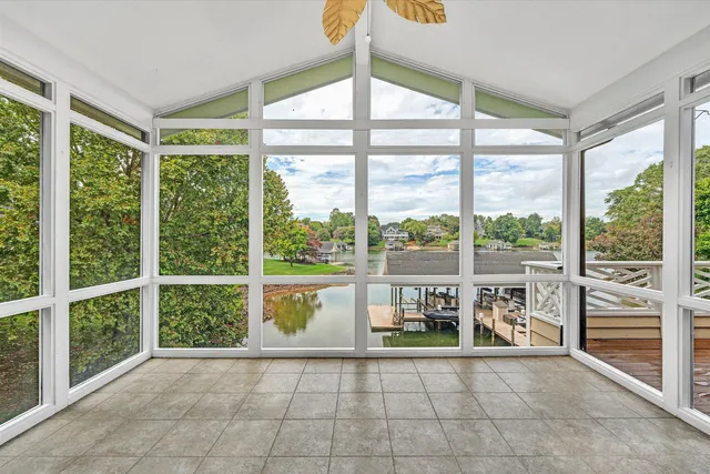 a living room with a large window and a table