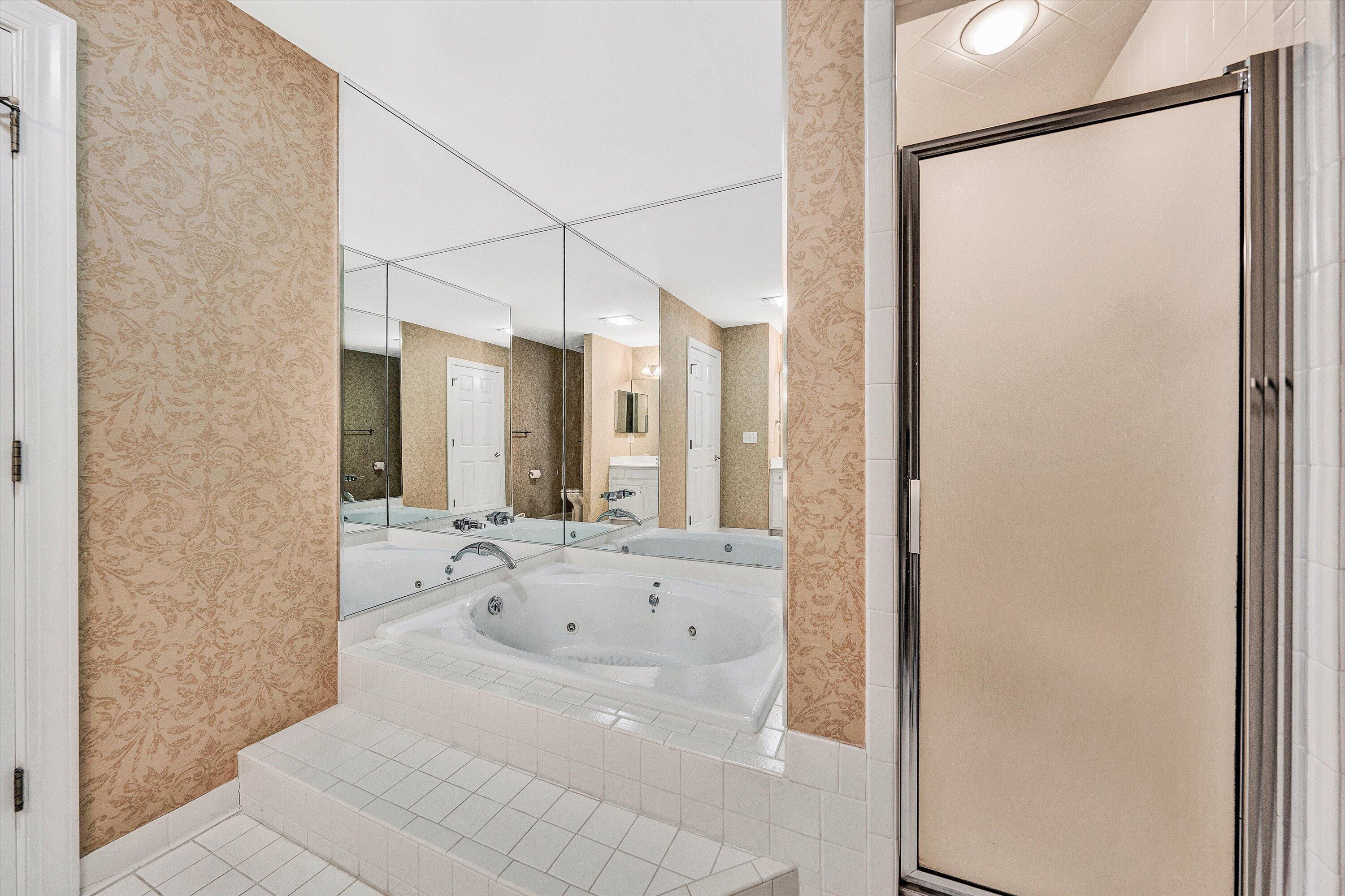 30 Island Green Circle, Unit 22 Penhook, VA 24137 - Photo 24 of 53 a bathroom with a bathtub and a shower