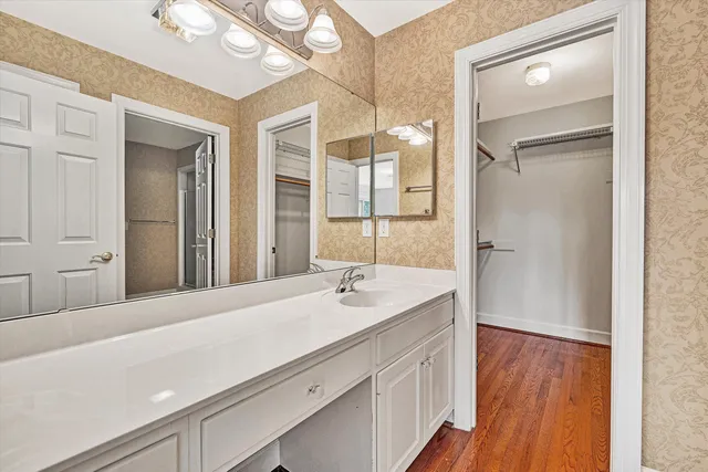 a bathroom with a sink and a mirror