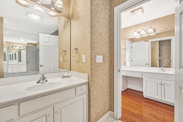 a bathroom with a sink double vanity and a mirror