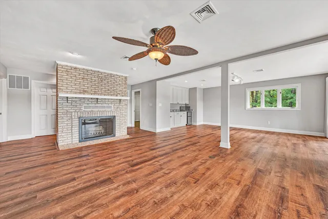 a view of kitchen and wooden floor