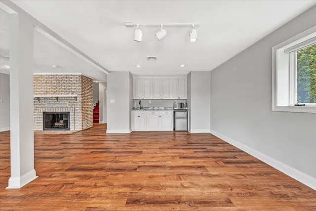a bathroom with a toilet a sink and a shower