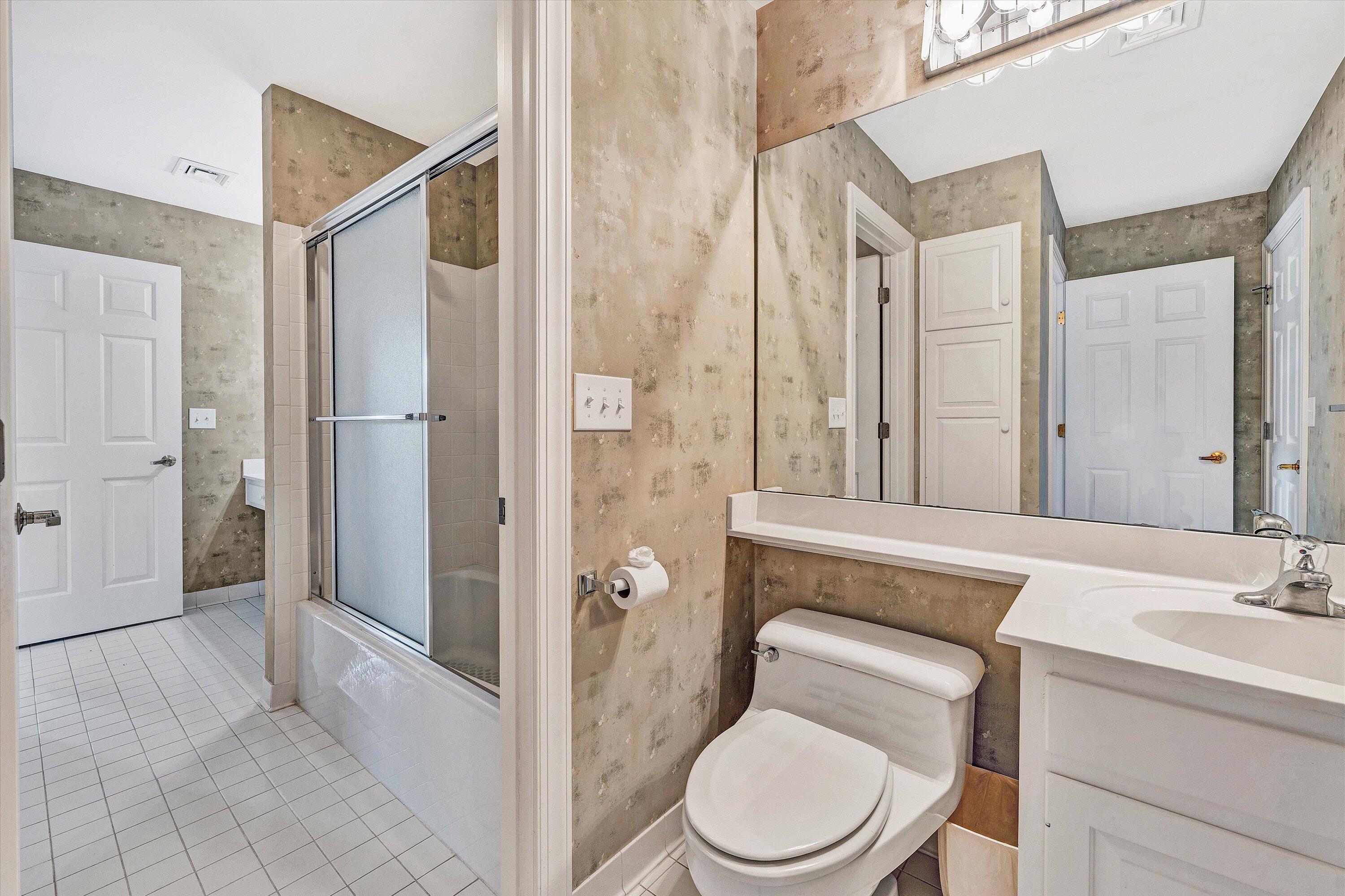 30 Island Green Circle, Unit 22 Penhook, VA 24137 - Photo 36 of 53 a bathroom with a toilet a sink and a shower