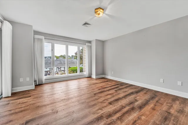 an aerial view of a house with swimming pool garden and patio