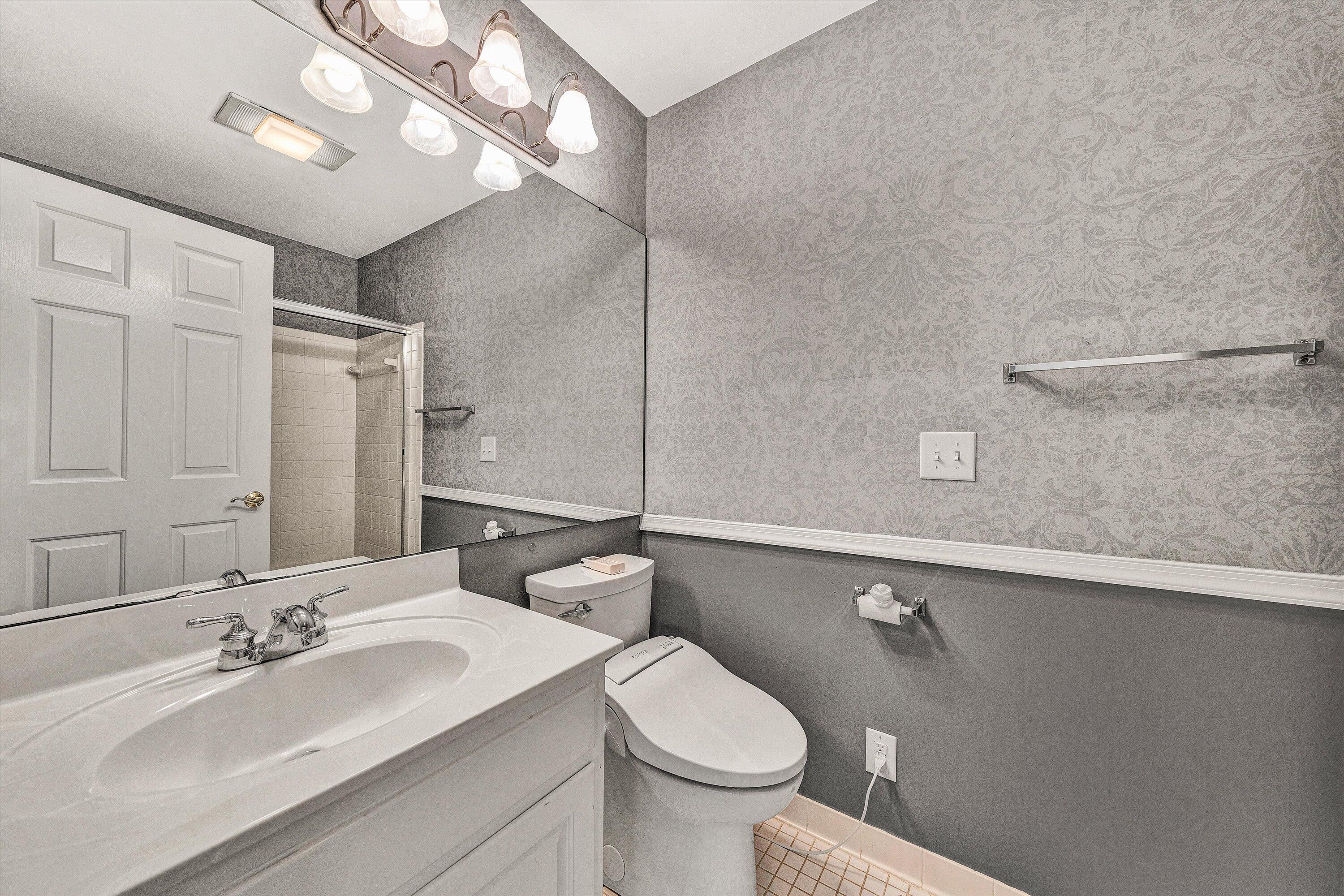 30 Island Green Circle, Unit 22 Penhook, VA 24137 - Photo 9 of 53 a bathroom with a sink vanity granite and toilet