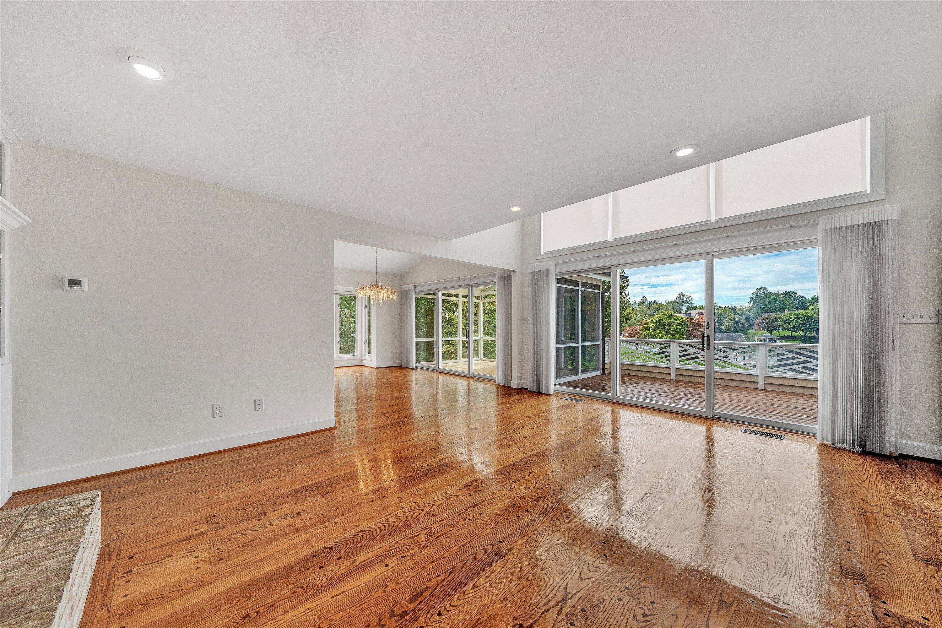 30 Island Green Circle, Unit 22 Penhook, VA 24137 - Photo 10 of 53 an empty room with wooden floor and windows