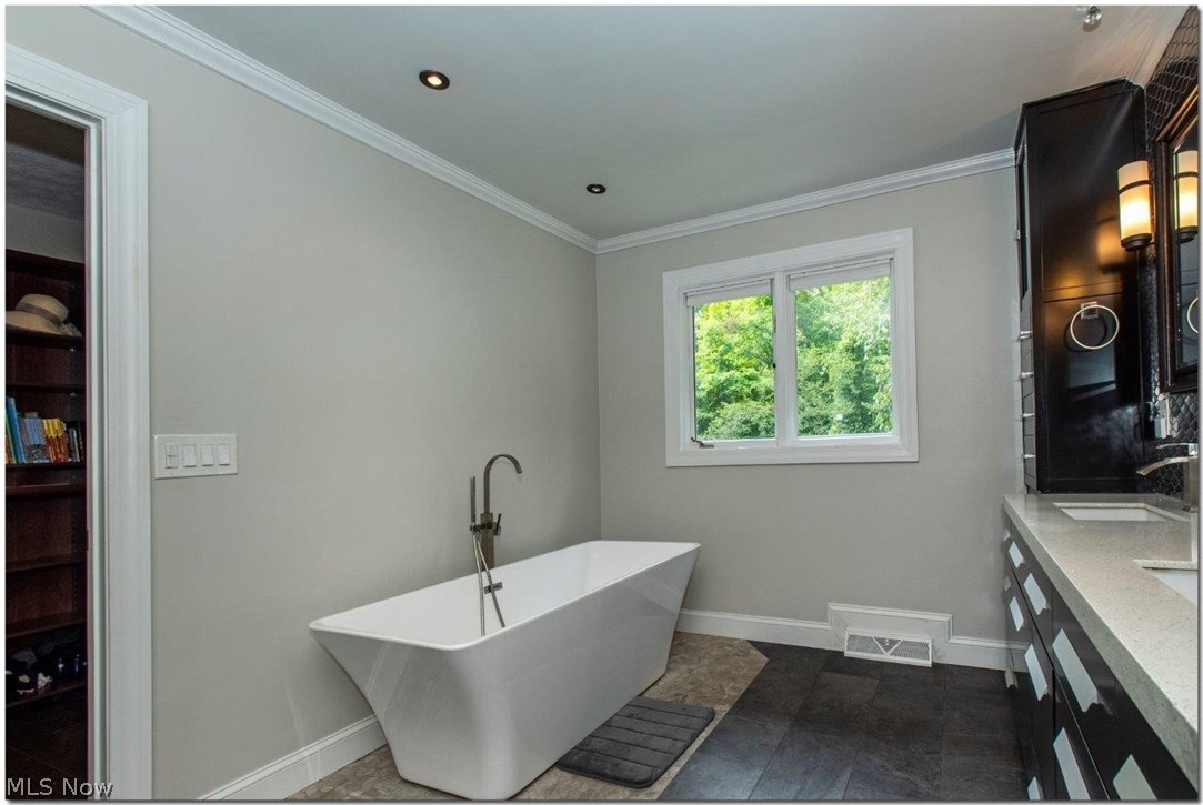 3200 Lander Road Pepper Pike, OH 44124 - Photo 22 of 35 French doors lead to the Owner’s Suite with walk-in closet and the lavish master bath features dual vanities, a soaking tub, and spacious glass shower