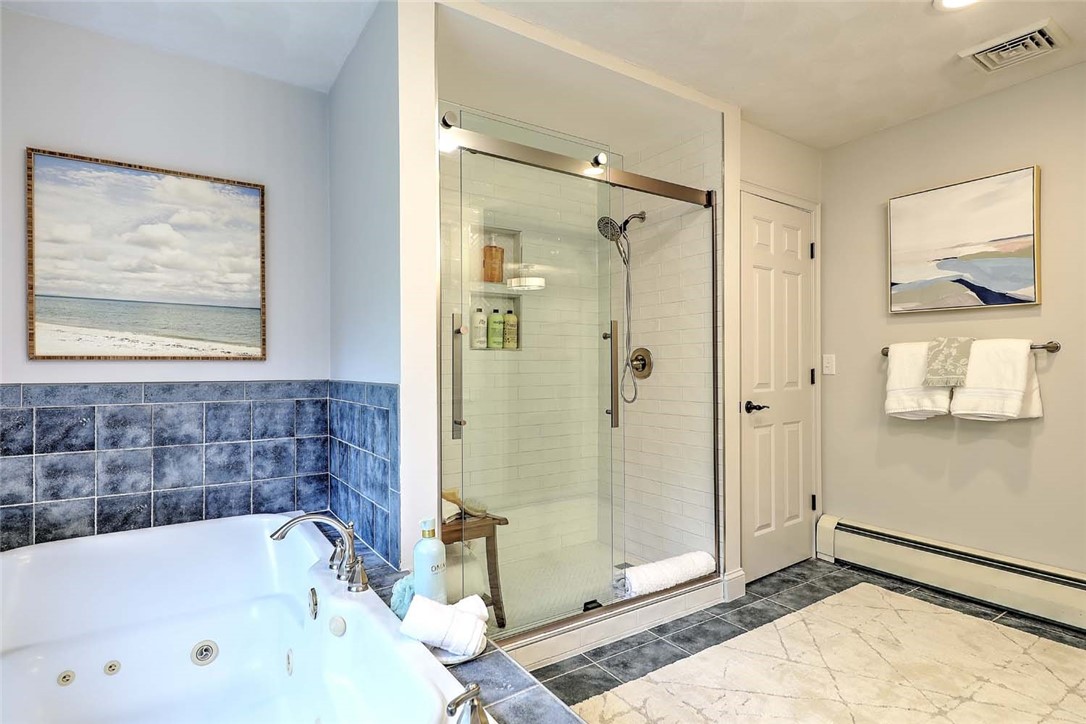 66 Tarklin Road Smithfield, RI 02814 - Photo 33 of 50 Tub and Tiled shower in the Primary Suite