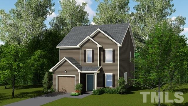6200 Cotter Ridge Court Raleigh, NC 27603 - Photo 22 of 25 a front view of a house with a yard and green space