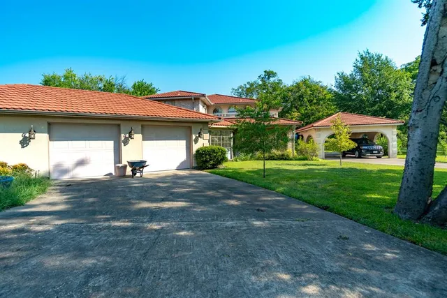a house view with a garden space