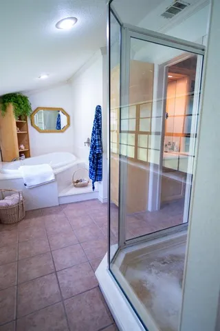 an aerial view of a house with yard and street view