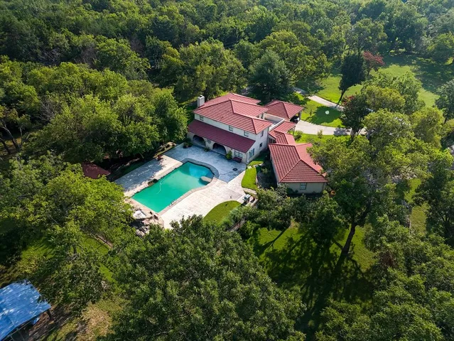 an aerial view of a house with a garden