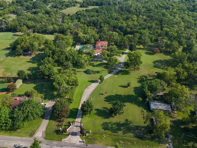 a black and white house with a yard