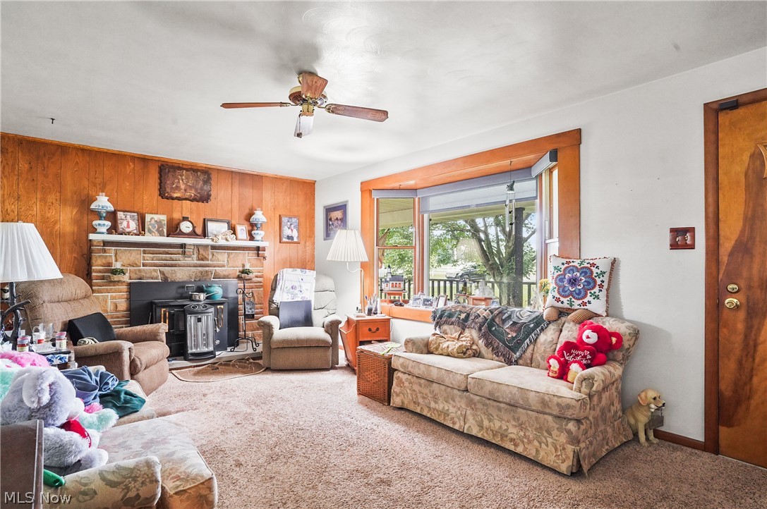 8264 Cook Road Berlin Center, OH 44401 - Photo 11 of 41 Sunroom featuring a bas/eboard heating unit and ceiling fan
