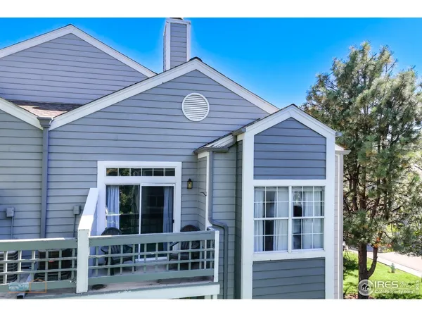 a view of house with front door and deck