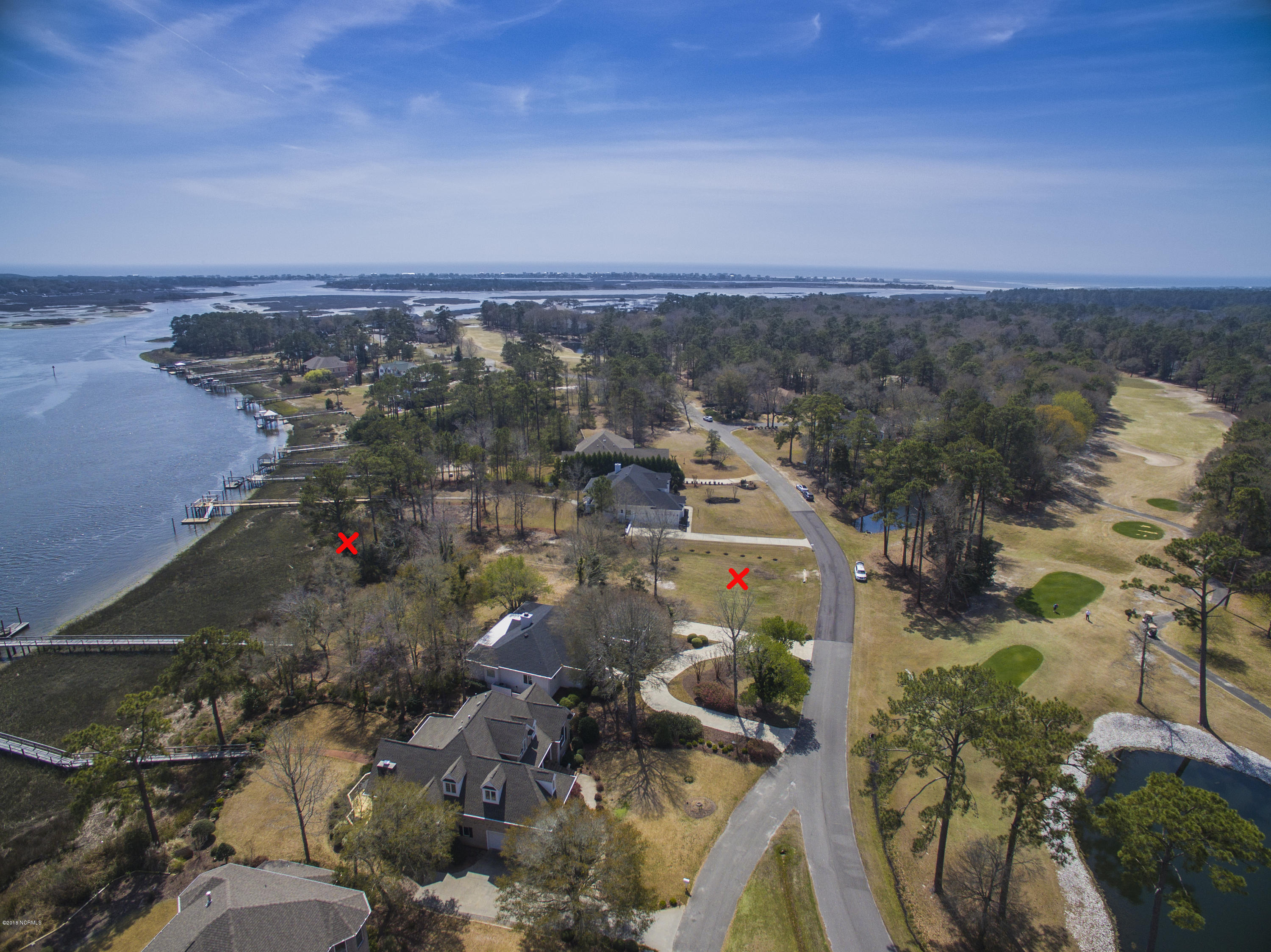 144 Genoe's Point Road Southwest Supply, NC 28462 - Photo 3 of 28 River front with golf fairway across Genoes Point Rd