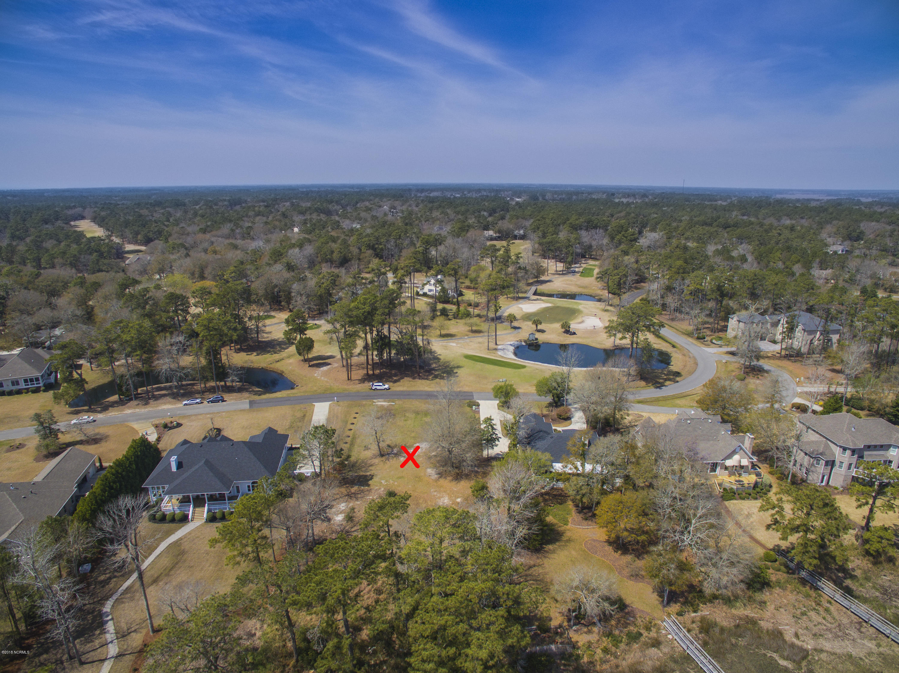 144 Genoe's Point Road Southwest Supply, NC 28462 - Photo 5 of 28 Golf course fairway across Genoes Point Rd