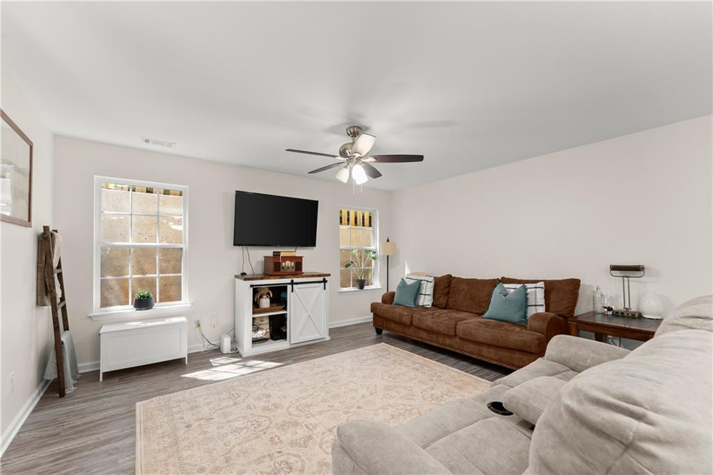 2407 Thompson Mill Road Gainesville, GA 30506 - Photo 11 of 35 a living room with furniture and a flat screen tv