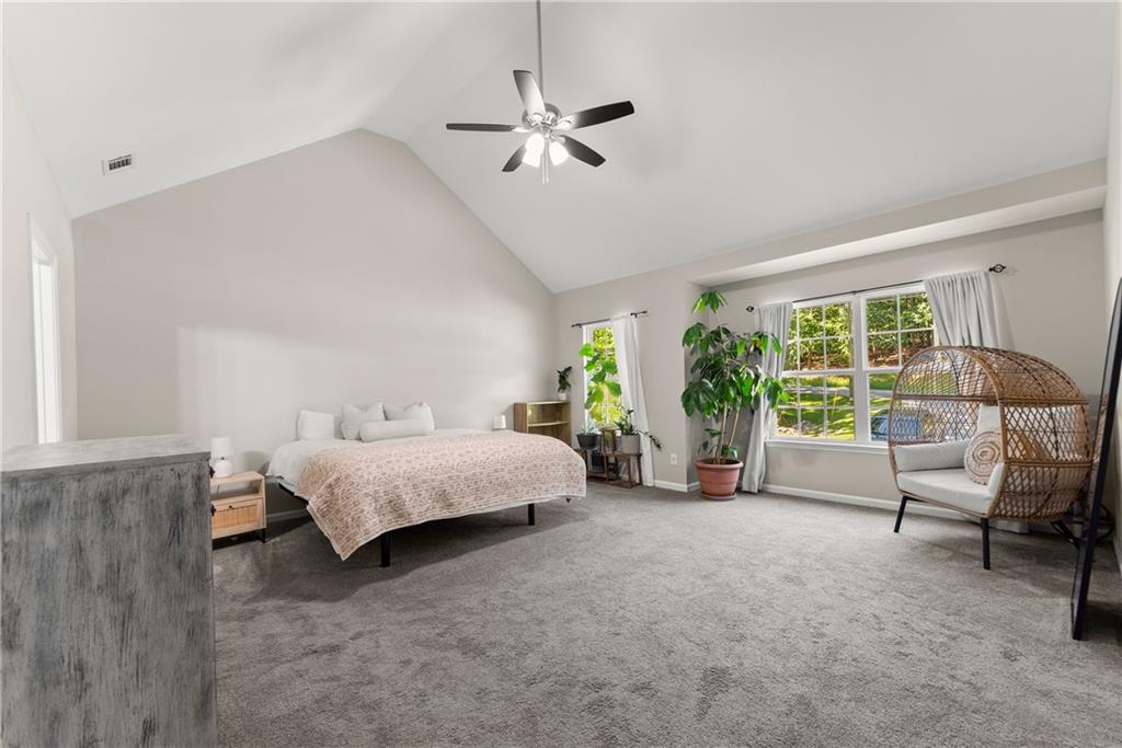 2407 Thompson Mill Road Gainesville, GA 30506 - Photo 18 of 35 a bedroom with furniture and a large window