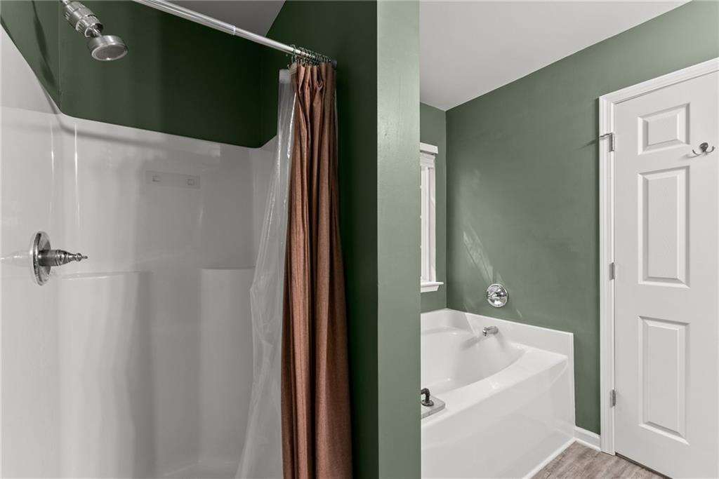 2407 Thompson Mill Road Gainesville, GA 30506 - Photo 22 of 35 a bathroom with a sink and mirror