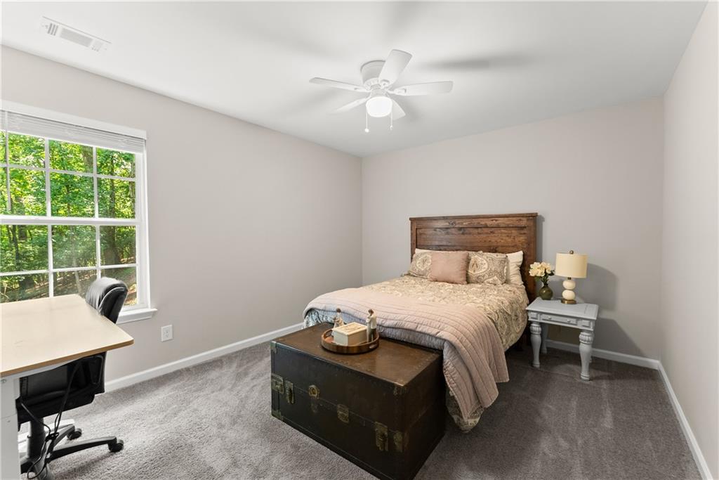 2407 Thompson Mill Road Gainesville, GA 30506 - Photo 26 of 35 a bedroom with a bed and a window