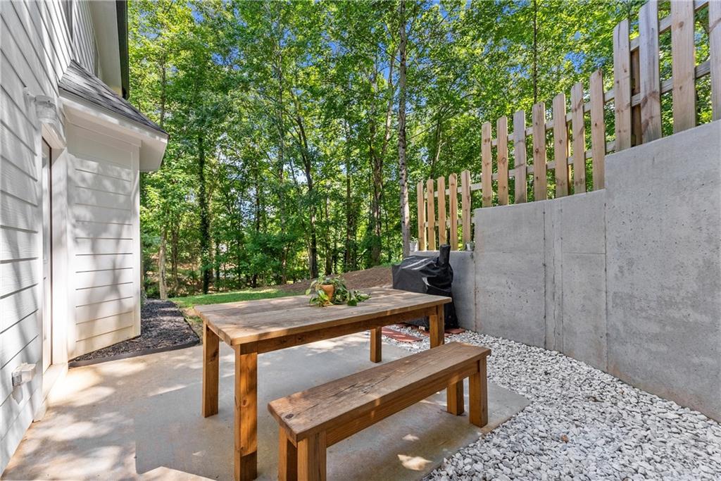 2407 Thompson Mill Road Gainesville, GA 30506 - Photo 29 of 35 a view of a wooden bench in the backyard