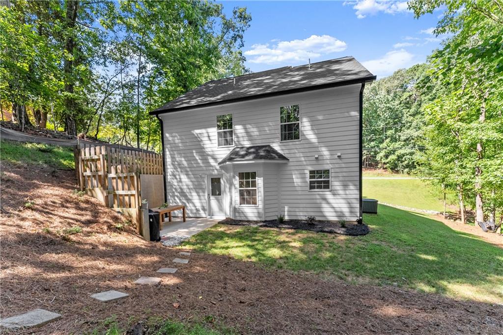 2407 Thompson Mill Road Gainesville, GA 30506 - Photo 32 of 35 a view of a house with yard and a tree
