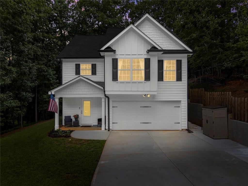 2407 Thompson Mill Road Gainesville, GA 30506 - Photo 7 of 35 a view of a yard in front of a house with a large tree
