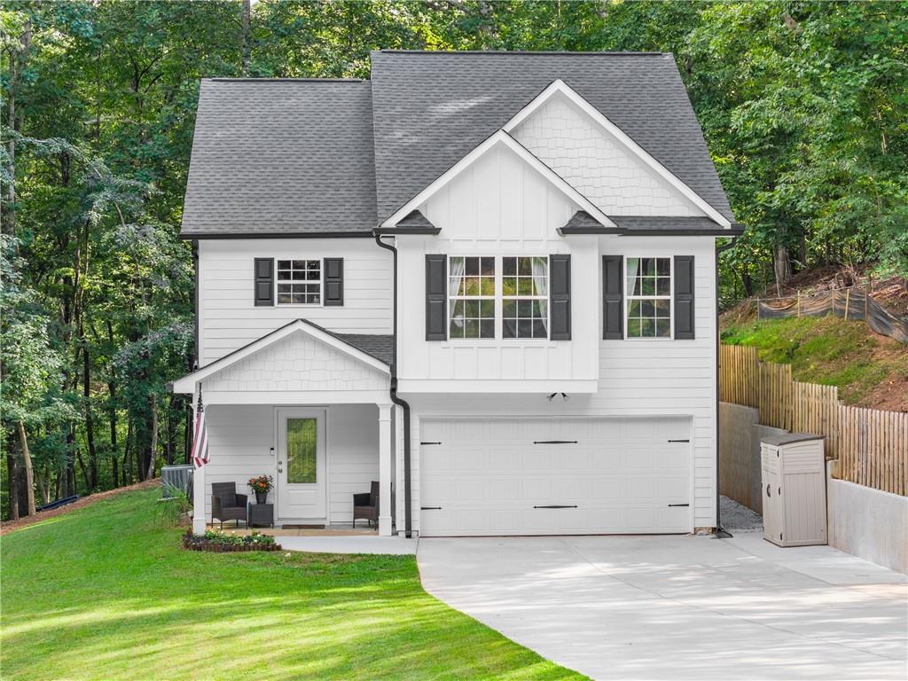 2407 Thompson Mill Road Gainesville, GA 30506 - Photo 8 of 35 a front view of a house with a yard