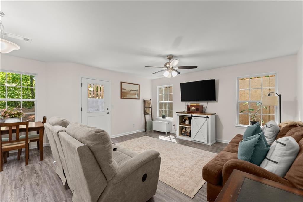2407 Thompson Mill Road Gainesville, GA 30506 - Photo 10 of 35 a living room with furniture and a flat screen tv