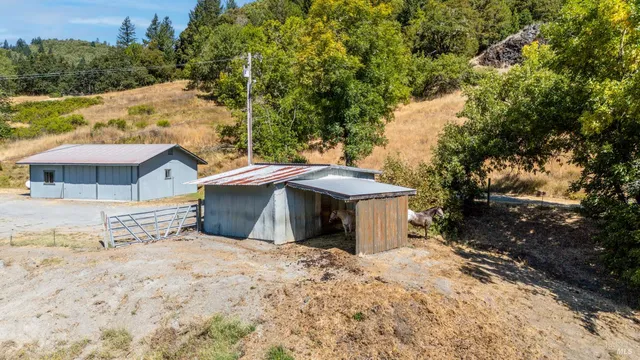 a view of a house with a yard and garage