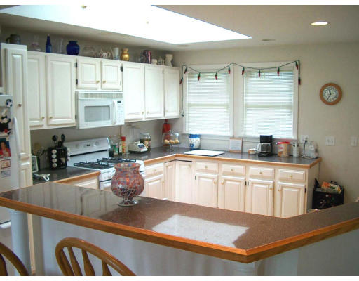 15 Bayview Road Marblehead, MA 01945 - Photo 5 of 6 a kitchen with granite countertop a sink stainless steel appliances and cabinets