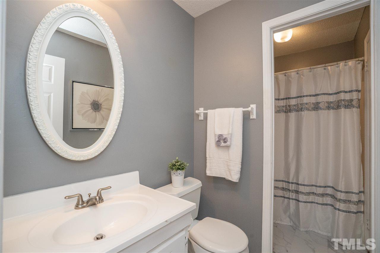 7500 Mine Valley Road Raleigh, NC 27615 - Photo 12 of 25 a bathroom with a sink toilet and shower