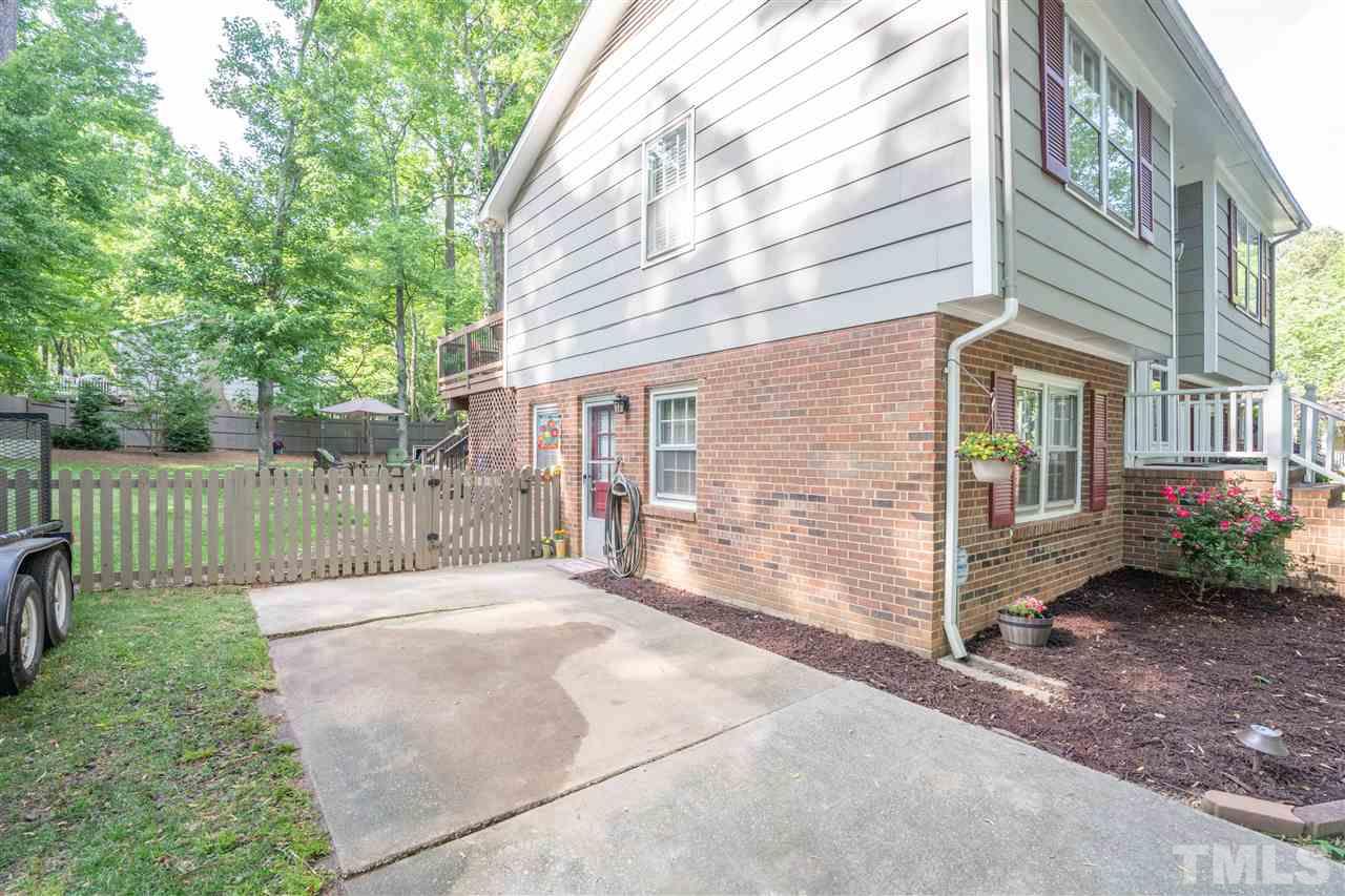 7500 Mine Valley Road Raleigh, NC 27615 - Photo 17 of 25 a view of a house with backyard and porch