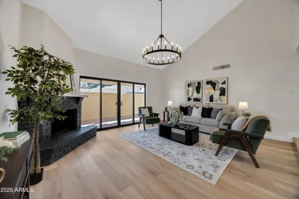 a view of a livingroom with furniture window and wooden floor