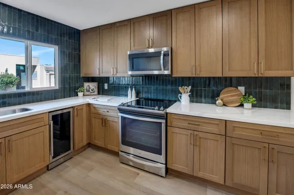 a kitchen with sink cabinets and window