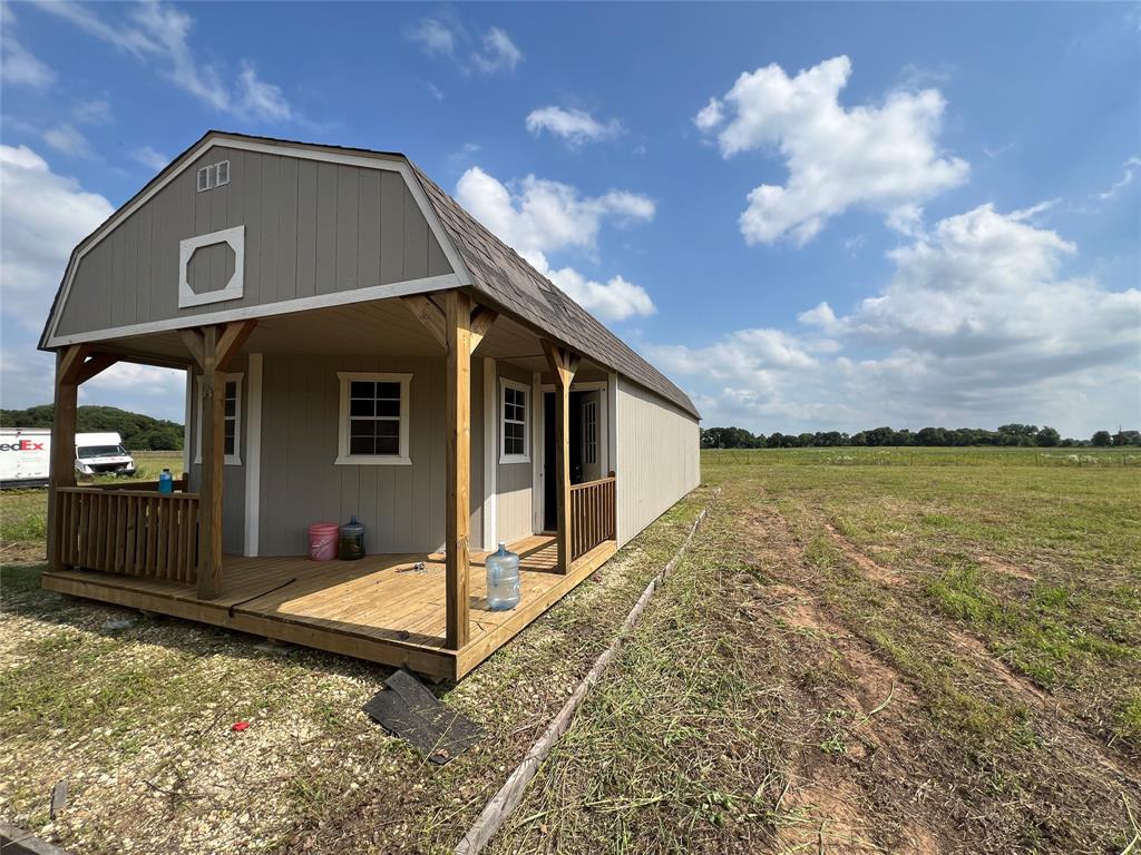 1757 County Road 252 Rising Star, TX 76471 - Photo 2 of 25 a view of a house with backyard