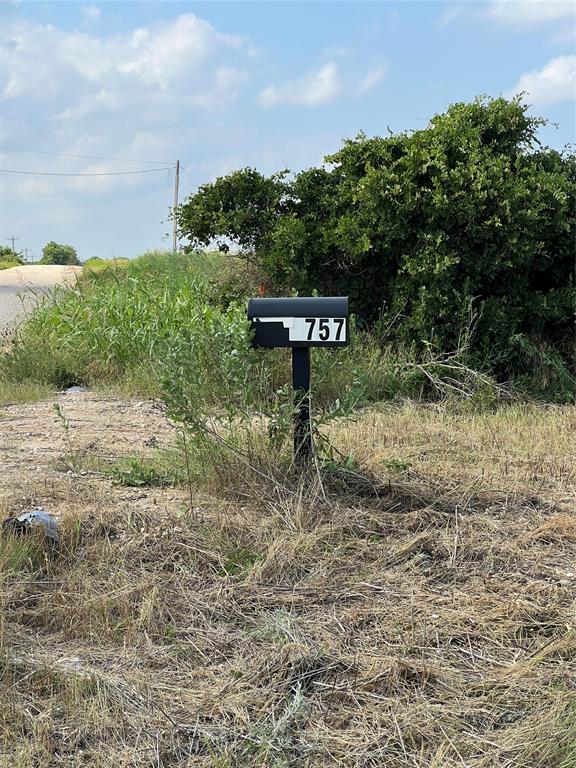 1757 County Road 252 Rising Star, TX 76471 - Photo 25 of 25 a view of a street with a bench in the back