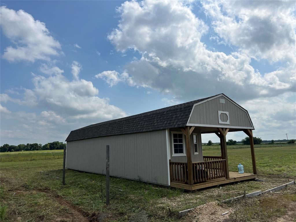 1757 County Road 252 Rising Star, TX 76471 - Photo 9 of 25 a front view of a house with garden