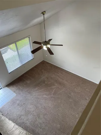 a view of an empty room with a window