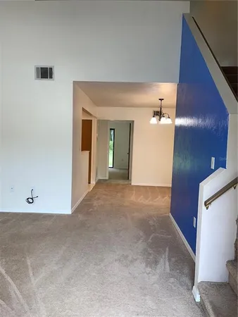 a view of a hallway with staircase