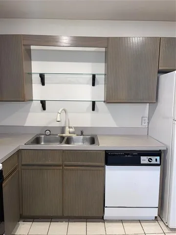 a kitchen with a sink and cabinets