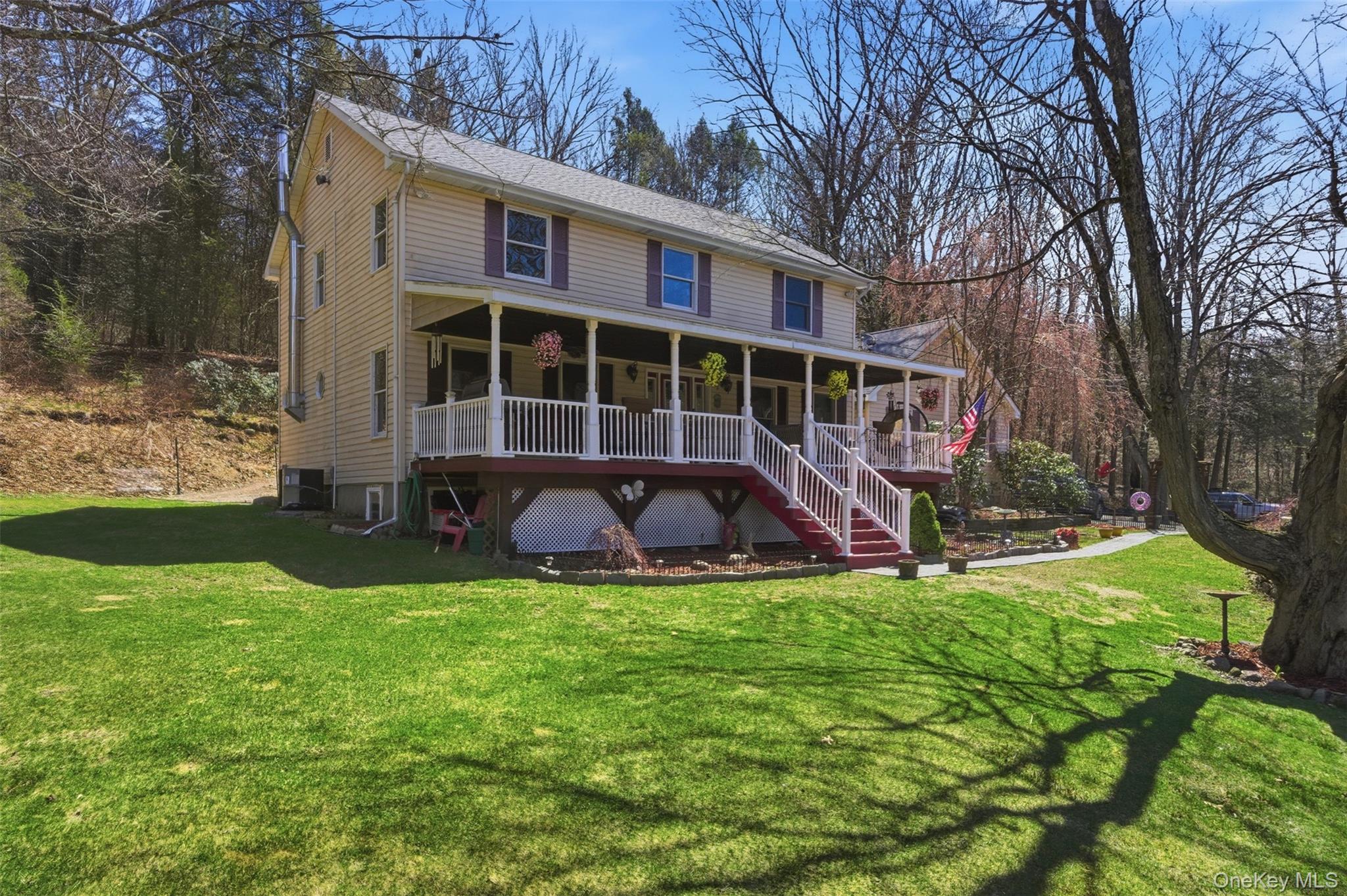 1285 Lakes Road Monroe, NY 10950 - Photo 36 of 45 a view of a house with a yard and sitting area