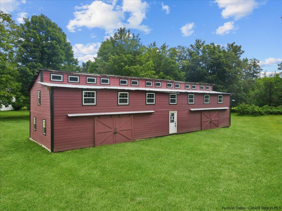 45 Pine Bush Road Stone Ridge, NY 12484 - Photo 13 of 34 a view of a deck with a yard