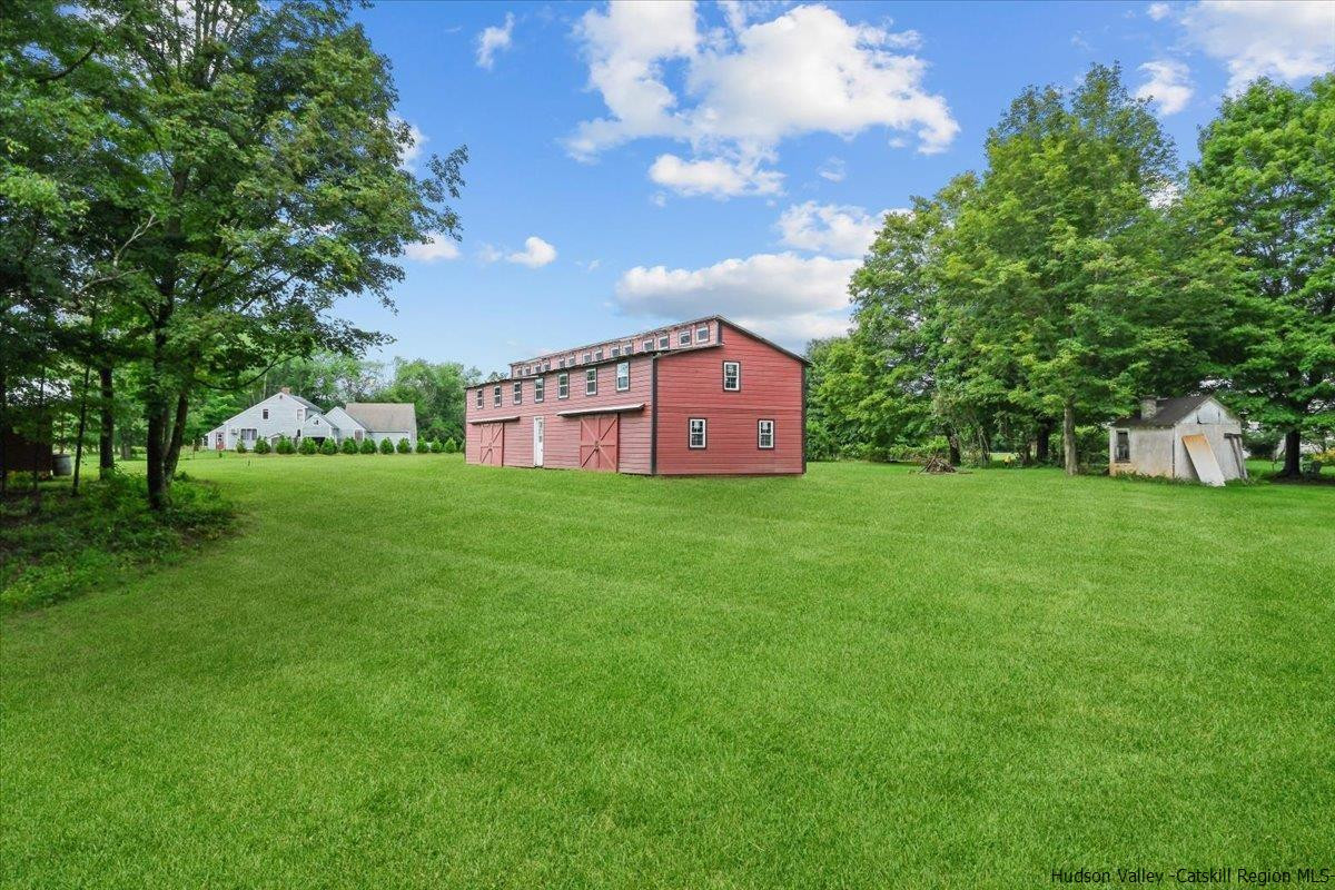45 Pine Bush Road Stone Ridge, NY 12484 - Photo 7 of 34 a view of a house with a big yard and large trees