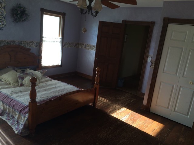 1645 Maytown Road Sublette, IL 61367 - Photo 16 of 21 a bedroom with a bed and a window