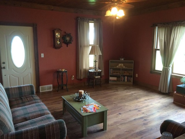 1645 Maytown Road Sublette, IL 61367 - Photo 10 of 21 a living room with furniture a window and a flat screen tv