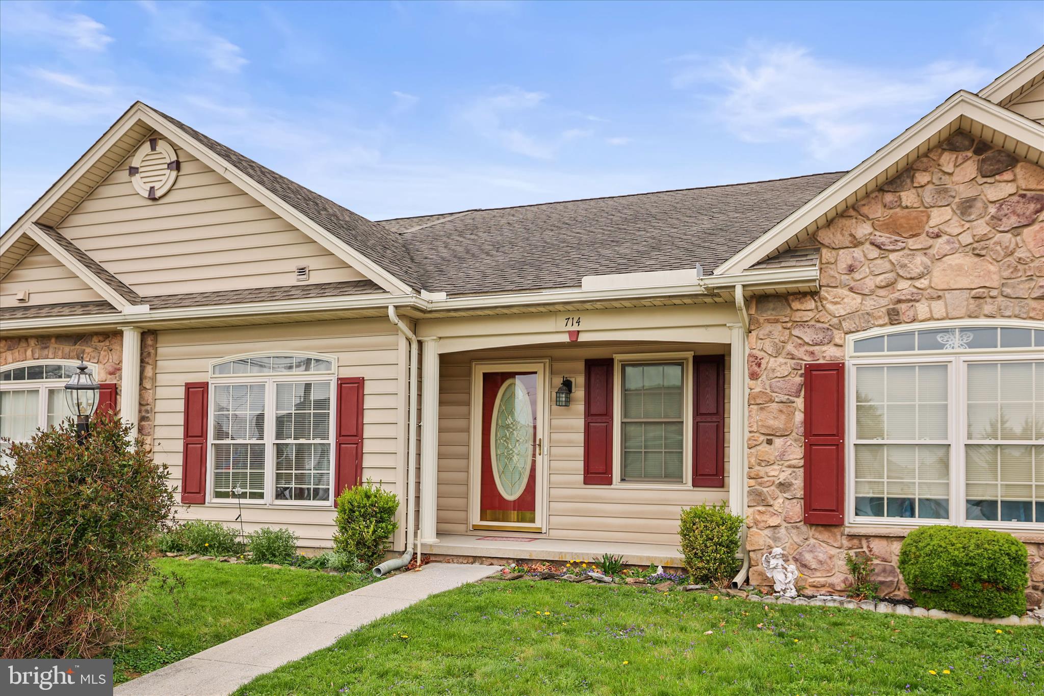 front view of a house with a yard